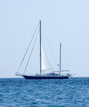 A ketch out on the ocean
on a sunny day