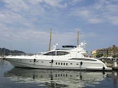 large image of a power boat
docked in a marina