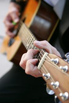 acoustic guitar being played